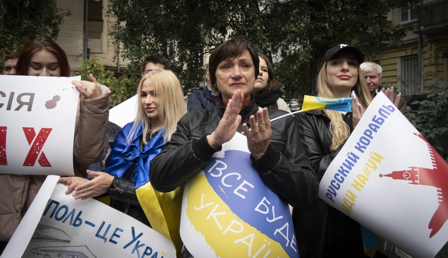 Residents of Mariupol hold a rally with banners reading "Mariupol is Ukraine" in Kyiv, Ukraine, on Saturday.