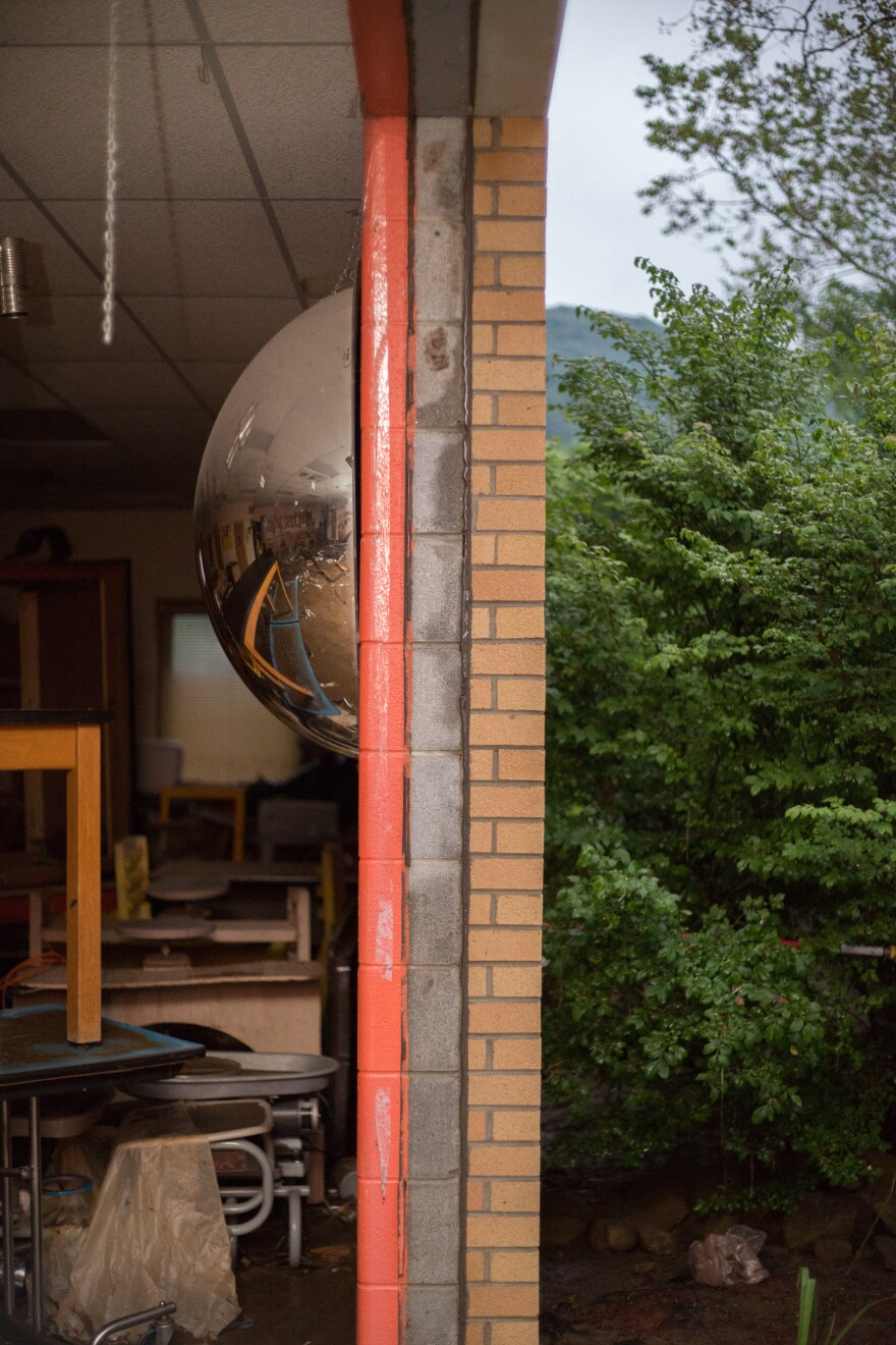 View of a window of the Richwood Middle School artroom. The floodwaters completely blew out the glass. You can see the classroom on the left, the lawn on the right.