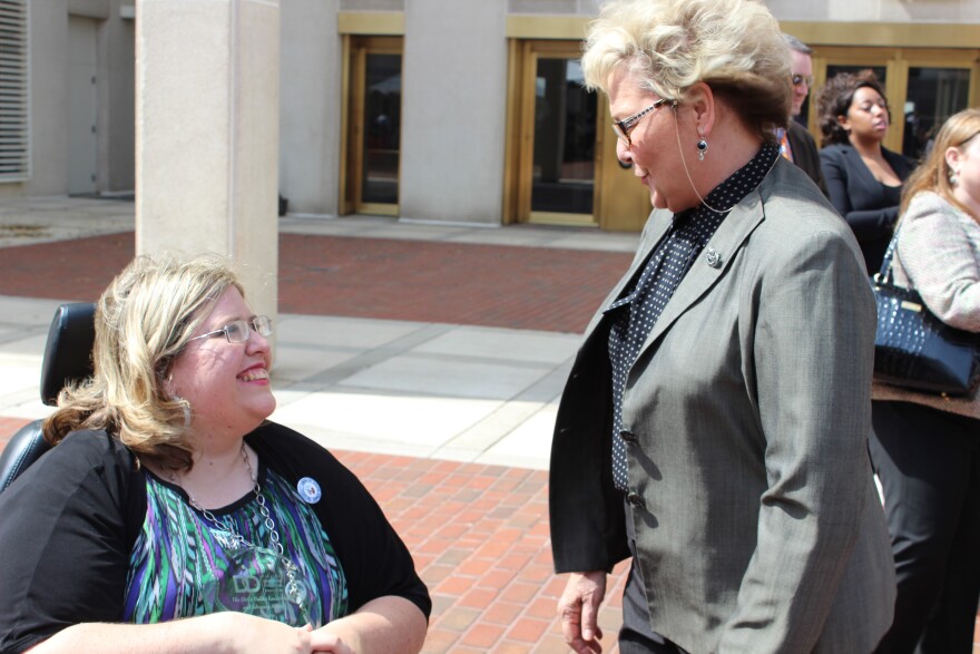 Agency for Persons with Disabilities Director Barbara Palmer speaking to award recipient and self-advocate Amanda Baker. (2013)