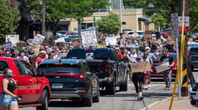 Demonstrators raise signs in the air during a protest in Oakley and Hyde Park as demonstrators continue to march in protest for the 15th straight day over the murder of George Floyd and other victims of police brutality, Friday, June 12.