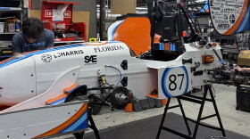 Gator Motorsports members testing ideas on last year's Formula-style race car in the team’s shop at the University of Florida.