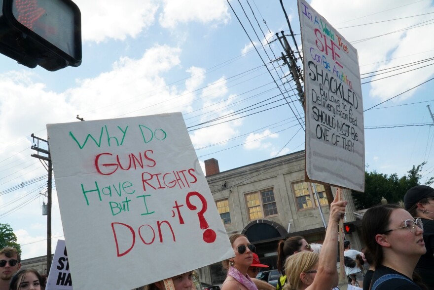 Signs at an abortion access protest along Bardstown Road in Louisville on July 4, 2022. 