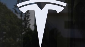 FILE - The Tesla logo is displayed at a Tesla dealership Thursday, Mar. 13, 2025, in Miami.