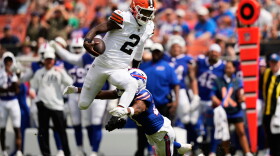 Cleveland Browns quarterback Shedeur Sanders (2) is tackled by Buffalo Bills cornerback Davison Igbinosun (21) during the first half of an NFL preseason football game, Saturday, Aug. 22, 2026, in Cleveland.
