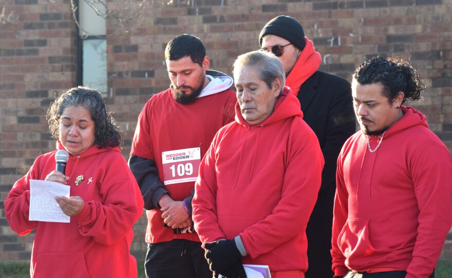Adriana Garcia Lopez, left, speaks Saturday, Nov. 22, 2025, outside Parkside Junior High School in Normal, as the her father, Francisco Garcia, middle, and others. She was addressing a crowd that gathered to honor her son, Edder Diaz, a PJHS seventh-grader who died Nov. 8, from injuries suffered in a house fire a week earlier.