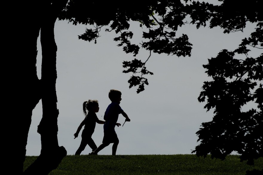 As states debate reopening schools, some child psychologists are expressing another worry— that schools won't be prepared to deal with kids' mental trauma when they do go back. (Charlie Riedel/AP)
