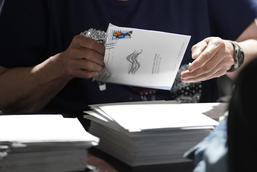 An election worker continues the process in counting ballots for the Pennsylvania primary election, Wednesday, May 18, 2022, at the Mercer County Elections Board in Mercer, Pa. Vote counting continues as Republican candidates Dr. Mehmet Oz and David McCormick are locked in a too-early-to-call race for Pennsylvania's hotly contested Republican nomination for an open U.S. Senate seat.