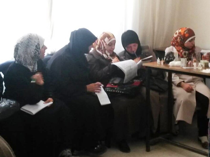 A group of Syrian women attend a nursing and first aid course at Women Now, a center run by Muzna al-Jundi in a northern rebel-held city. Jundi has kept the center going, even after Russian bombing intensified.