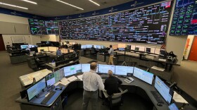 Control room staff at ISO New England monitor the weather and energy demand on the grid
