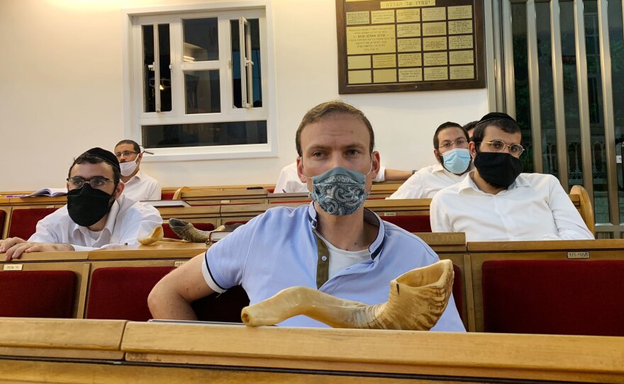 Chaim Braun (center), a diamond dealer, attends the shofar-blowing course.
