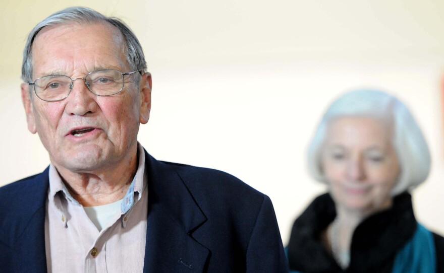 Korean War veteran Merrill Newman (left), accompanied by his wife, Lee, speaks to the media after arriving at San Francisco International Airport on Dec. 7, 2013, following his release from detention in North Korea. Pyongyang deported Newman after detaining him for two months for "hostile acts" against the communist country.