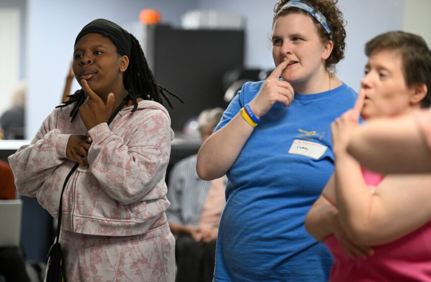 Tyra, left, and other women who will play Ariel practice dances and songs for the show.