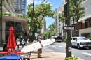 Tourists in Waikīkī with surfboards