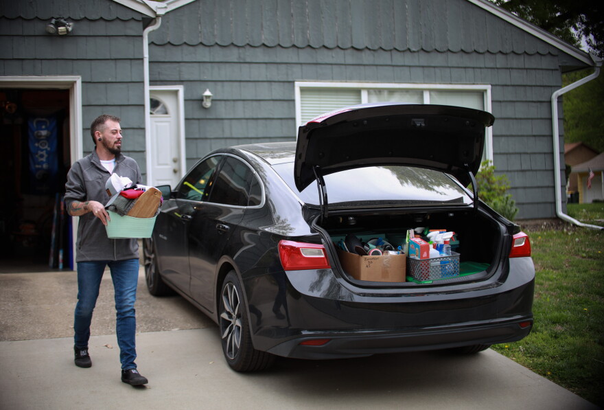  Alexxander Abreu, a Kansas Citian by heart, loads his car as he prepares to move out of state. 