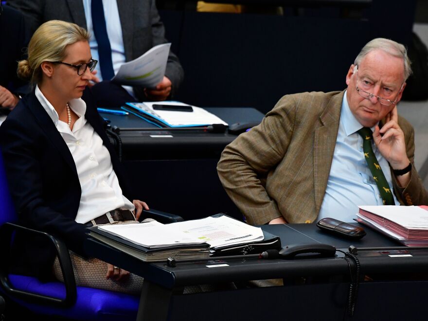 Alternative for Germany leaders Alexander Gauland and Alice Weidel listen to German Chancellor Angela Merkel answer questions at Germany's parliament on June 6.