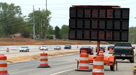 A sign along State Road 37 north instructs drivers to make a U-turn in order to access Thompson Furniture.