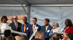 Stakeholders hold up skeleton keys signifying the U.S. Department of Veterans Affairs taking ownership of Tulsa’s new veterans hospital during a Tuesday ceremony.