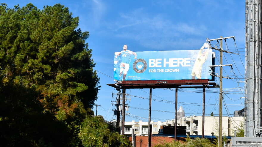 Charlotte FC rents this billboard from Adams Outdoor Advertising in Plaza Midwood.