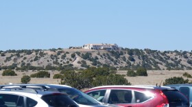 A view of Zorro Ranch from NM-41 as protesters' cars line the road