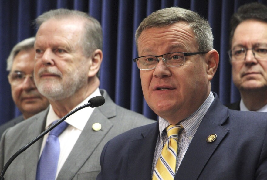 North Carolina House Speaker Tim Moore, center, speaks at a news conference about a Medicaid expansion agreement, Thursday, March 2, 2023, at the Legislative Building in Raleigh, N.C.