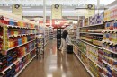 Grocery Manager Ray Veilleux stocks shelves Wednesday, July 22, 2009, at the Hannaford supermarket in Augusta, Maine.