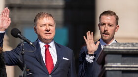 Oklahoma Attorney General Gentner Drummond (left) and state schools superintendent Ryan Walters (right), take the oath of office. Both filed seaerate lawsuits against Joe Biden's administration Monday.