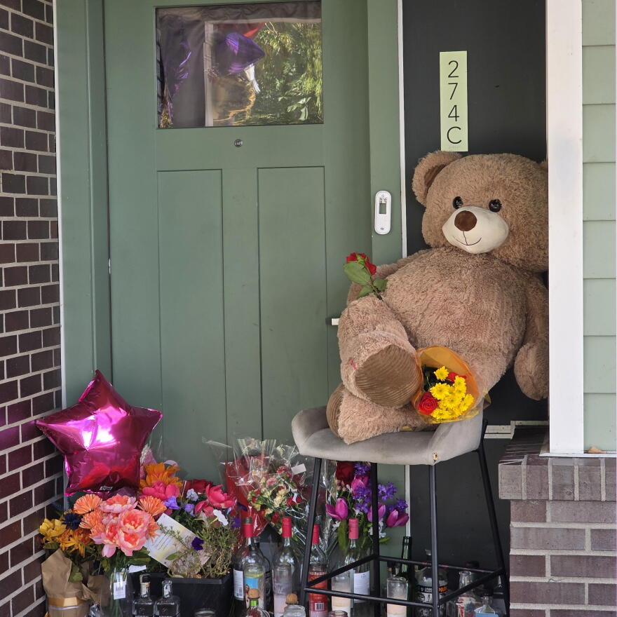 A memorial outside Dominique Mack’s apartment on Alabama Street. Mack, 25, was fatally shot earlier this week.