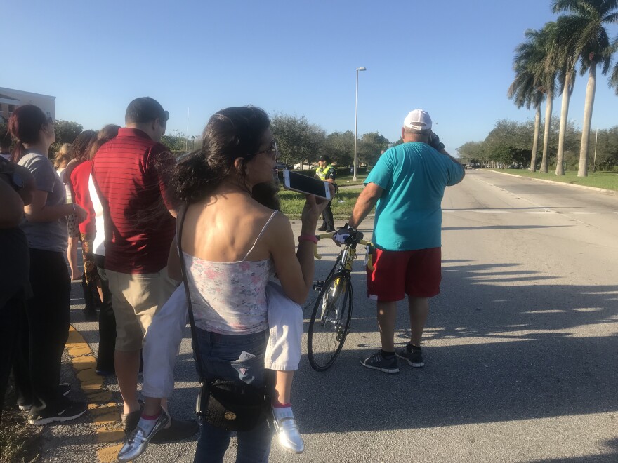 Anxious parents waited around the school trying to reunite with their children.