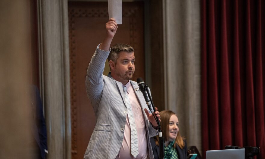 Missouri state Rep. Ian Mackey, D-St. Louis, raises his hand to speak on a bill that seeks to incentivize sports teams to stay in Missouri.