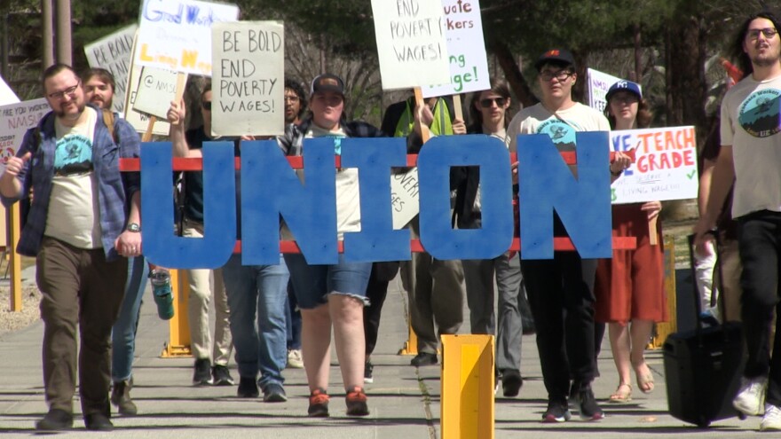 Graduate workers march to the NMSU administration offices to hand in their intent to bargain.