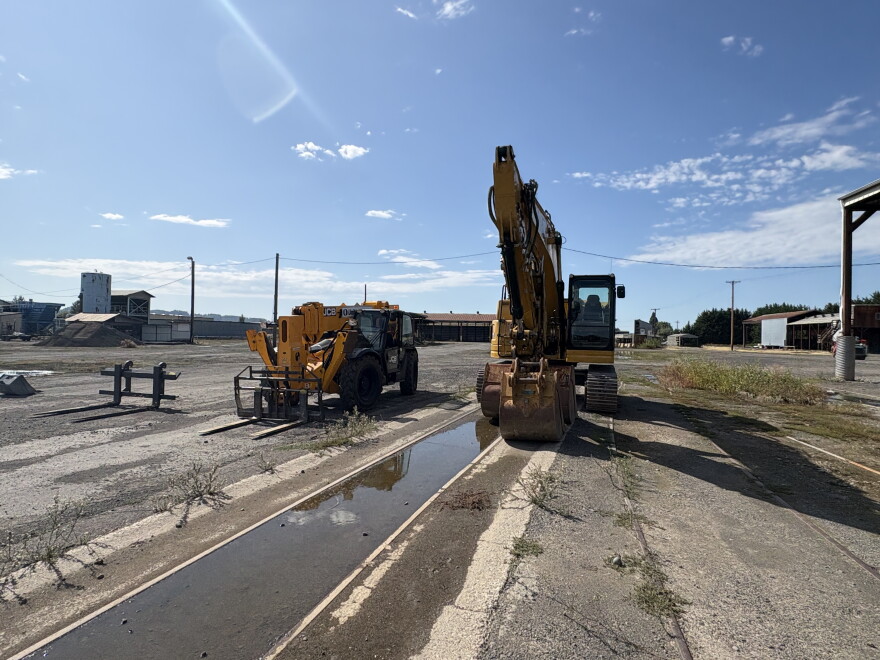 Construction equipment on old plant grounds. 