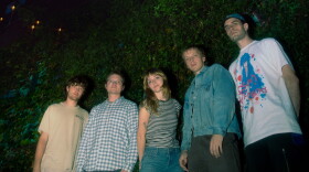 a group of individuals pose for a photograph 