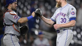 New York Mets relief pitcher Jake Diekman (30) and catcher Luis Torrens, left, celebrates after a baseball game against the Washington Nationals, Monday, June 3, 2024, in Washington. (AP Photo/Nick Wass)