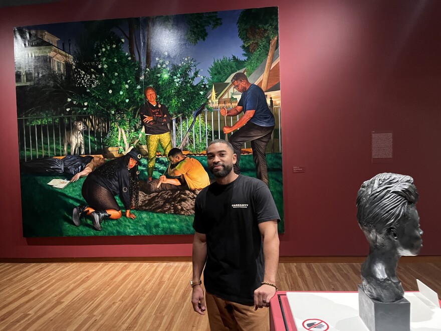 Mario Moore, 38, is the artist behind the 'In Pursuit of Home' exhibit on display at the Harvey B. Gantt Center for African American Arts + Culture.