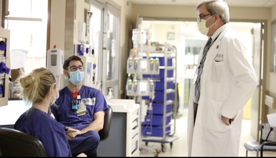 URMC Chief medical officer Dr. Michael Apostolakos (right) meets with ICU staff on May 18, 2020.