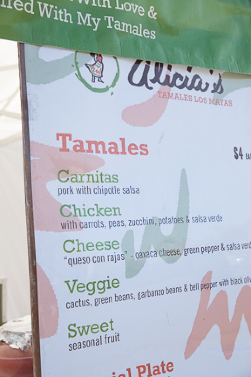 Villanueva used <em>tanda</em> cash to buy fliers and signs to help advertise Alicia's Tamales Los Mayas.