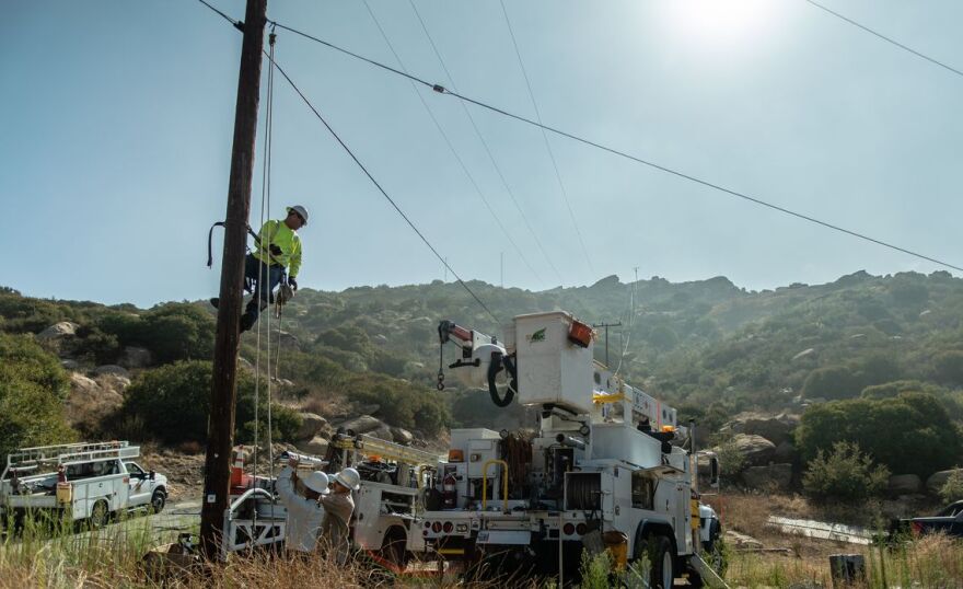 SoCal Edison works seen working on a power line.