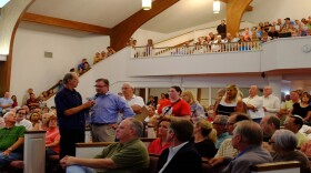 Shaken residents line up inside Edmond's Waterloo Baptist Church to voice concerns and ask representatives from the Corporation Commission and the state Geological Survey questions about recent earthquakes.
