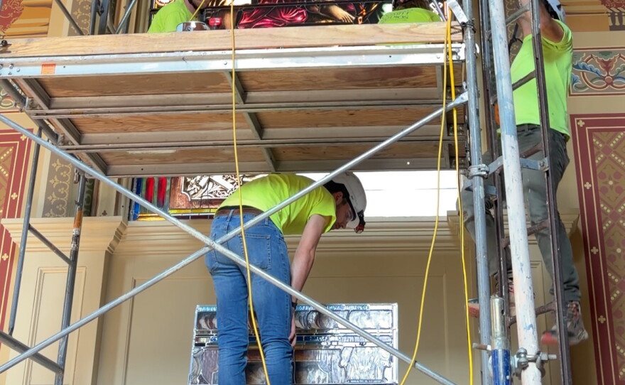 Artisans are taking apart, removing and then reassembling every stained glass window.