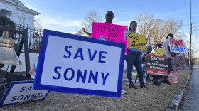 People gather outside the Alabama Governor's Mansion in Montgomery, Ala., on Feb. 16, 2026, to urge Gov. Kay Ivey to grant clemency to Sonny Burton, who is scheduled to be executed on March 12, 2026. (AP Photo/Kim Chandler)