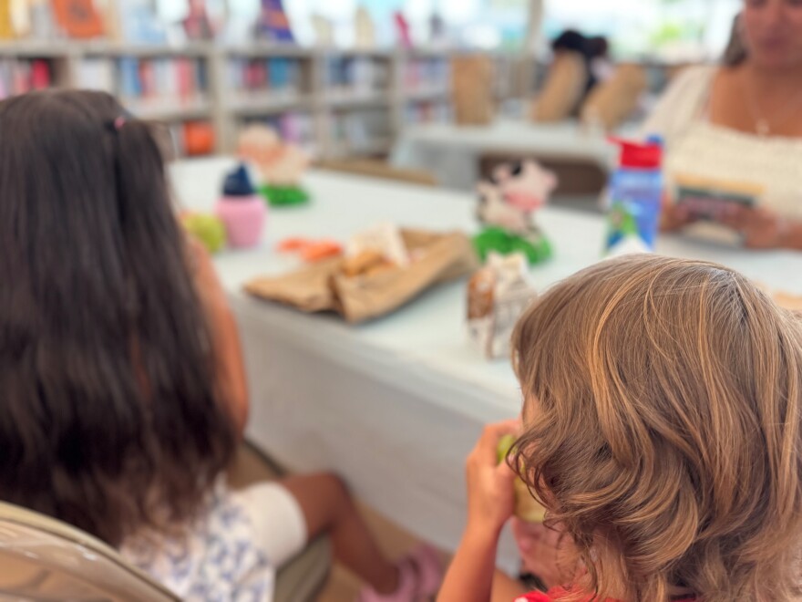 Kids at Ray D. Prueter Library tuck into their free lunch