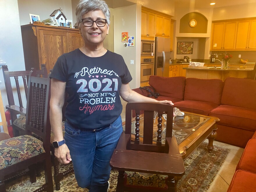 Norma Jasso, 62, sped up retirement plans after her daughter asked for help with a new baby. She stands with a high chair her father had commissioned from a shop in Sinaloa, Mexico. Her daughters used it and now her grandson will too.