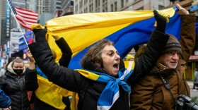 Demonstrators rally in New York City's Times Square in support of Ukraine on Thursday.
