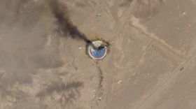 A satellite image from Thursday shows smoke billowing from a launch pad at the Imam Khomeini Space Center in northern Iran.