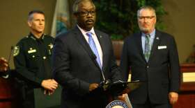 Orange County Mayor Jerry Demings (center), Orange County Sheriff John Mina (left) and Orlando Mayor Buddy Dyer (right) brief the media Monday. Photo: Orange County