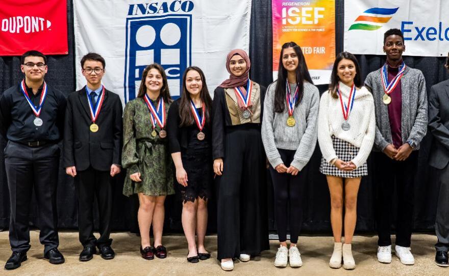 Brandon Cai (second from left), Maryam Abdel-Azim (fifth from left), host Rayna Malhotra (next), Raina Bandekar (right) and Okezue Bell (last) at the Delaware Valley Science Fair Finals.