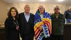 William Huntress (center right), Seneca Nation President J.C. Seneca (center left), Councilor Odie Porter (far left) and Councilor Rickey Armstrong (far right) during a ceremony for the Grand Island land donation.