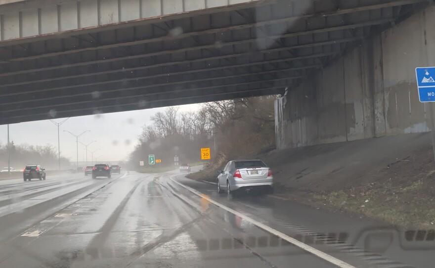 a car stranded on the side of a highway
