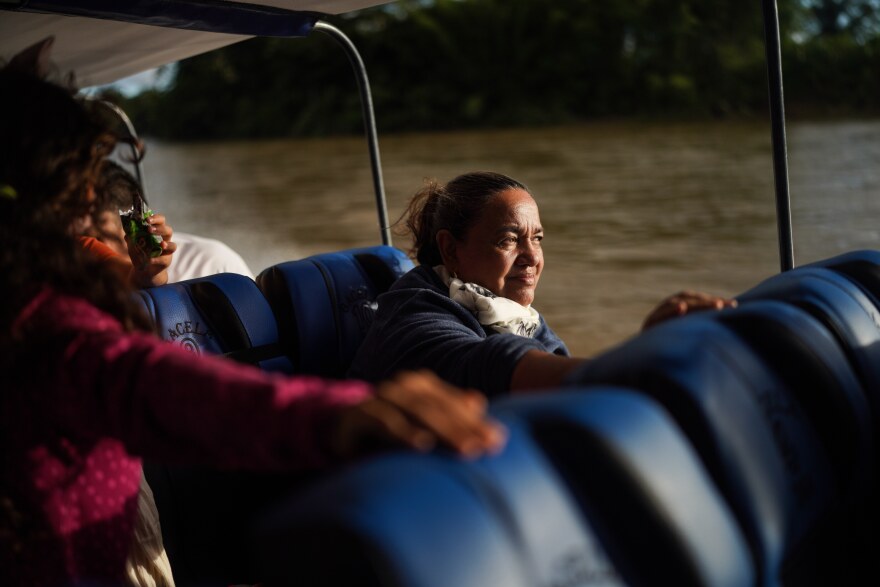 Jani Silva, 63, sails in a boat on the Putumayo River, on the outskirts of Puerto Asis, Colombia, Wednesday, Nov. 26, 2025.