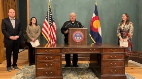 Crisosto Apache (center) was announced as Colorado's new poet laureate at the State Capitol in Denver on Jan. 28, 2026.